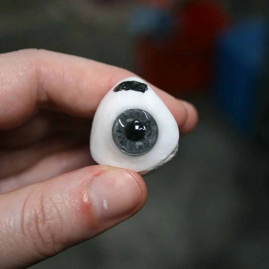 Hand-painted prosthetic eye with carefully matched iris detail, designed to reflect the wearer's own natural eye character